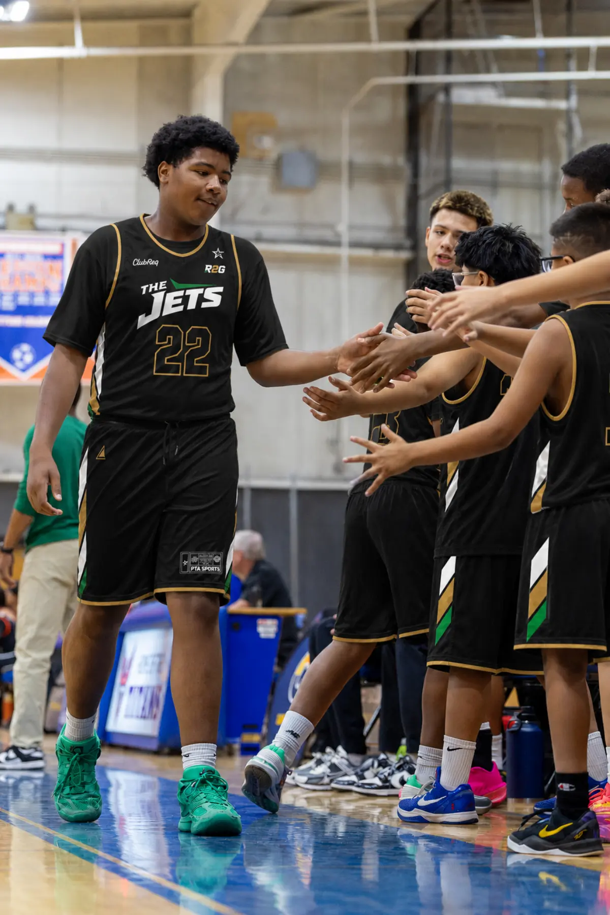 R2G Jets player being welcomed by his teammates